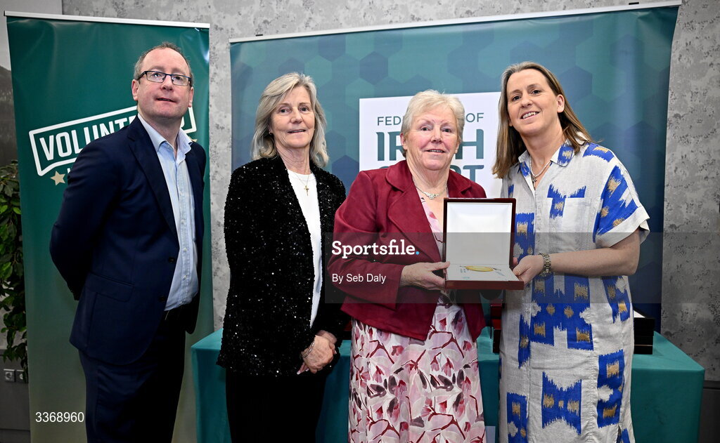 26 February 2026; Lucy Mooney of Hollywood GAA Club, Wicklow, is presented with her award by Federation of Irish Sport chief executive officer Mary O'Connor, Federation of Irish Sport chair Clare McGrath, and Dun Laoghaire Rathdown Sports Partnership coordinator Shane McArdle, during the Volunteers in Sport Awards 2025, hosted by the Federation of Irish Sport and supported by the National Network of 29 Local Sports Partnerships, at The Crowne Plaza Hotel in Blanchardstown, Dublin. Photo by Seb Daly/Sportsfile