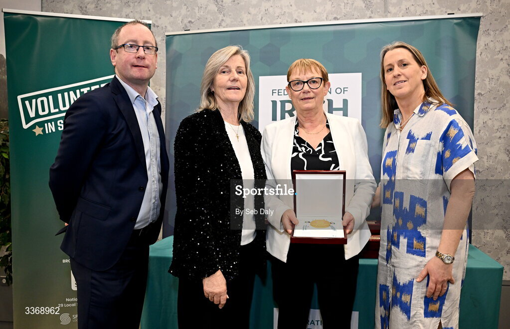 26 February 2026; Louise Foster of Kestrels Basketball Portarlington, Laois, is presented with her award by Federation of Irish Sport chief executive officer Mary O'Connor, Federation of Irish Sport chair Clare McGrath, and Dun Laoghaire Rathdown Sports Partnership coordinator Shane McArdle, during the Volunteers in Sport Awards 2025, hosted by the Federation of Irish Sport and supported by the National Network of 29 Local Sports Partnerships, at The Crowne Plaza Hotel in Blanchardstown, Dublin. Photo by Seb Daly/Sportsfile