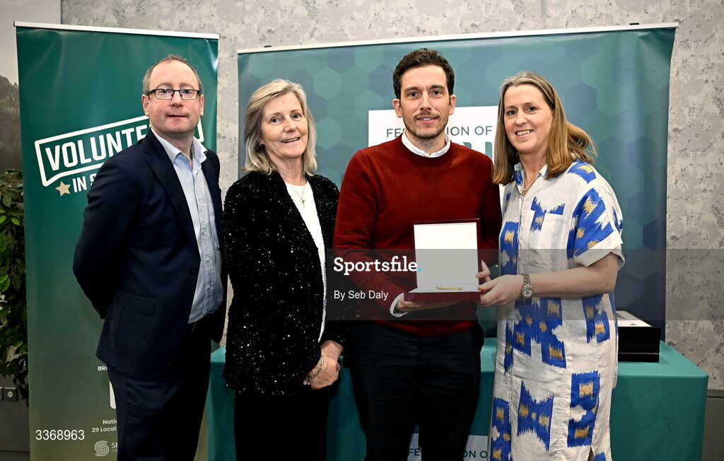 26 February 2026; Andrew Gallagher of Castletown Belles FC, Louth, is presented with his award by Federation of Irish Sport chief executive officer Mary O'Connor, Federation of Irish Sport chair Clare McGrath, and Dun Laoghaire Rathdown Sports Partnership coordinator Shane McArdle, during the Volunteers in Sport Awards 2025, hosted by the Federation of Irish Sport and supported by the National Network of 29 Local Sports Partnerships, at The Crowne Plaza Hotel in Blanchardstown, Dublin. Photo by Seb Daly/Sportsfile