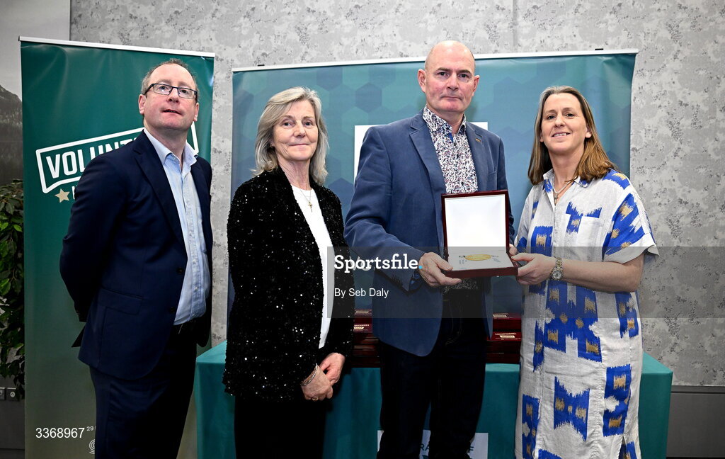 26 February 2026; Adrian Curley of Tullamore Harriers, Offaly, is presented with his award by Federation of Irish Sport chief executive officer Mary O'Connor, Federation of Irish Sport chair Clare McGrath, and Dun Laoghaire Rathdown Sports Partnership coordinator Shane McArdle, during the Volunteers in Sport Awards 2025, hosted by the Federation of Irish Sport and supported by the National Network of 29 Local Sports Partnerships, at The Crowne Plaza Hotel in Blanchardstown, Dublin. Photo by Seb Daly/Sportsfile