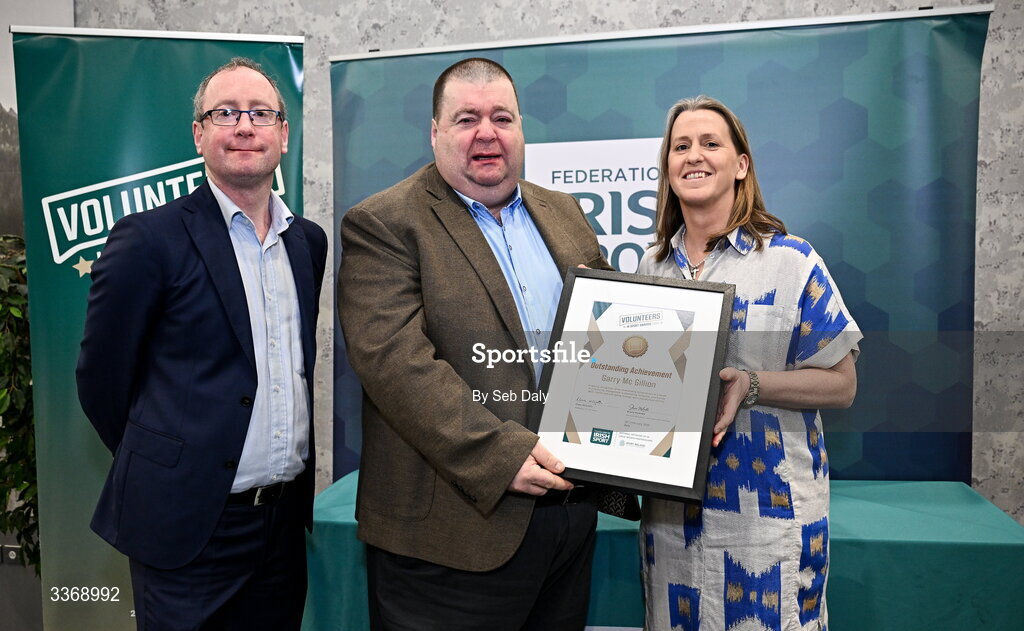 26 February 2026; Outstanding Achievement Award recipient Garry McGillion of Bishop Kelly Boxing Club, Tyrone, is presented with his award by Federation of Irish Sport chief executive officer Mary O'Connor, and Dun Laoghaire Rathdown Sports Partnership coordinator Shane McArdle, during the Volunteers in Sport Awards 2025, hosted by the Federation of Irish Sport and supported by the National Network of 29 Local Sports Partnerships, at The Crowne Plaza Hotel in Blanchardstown, Dublin. Photo by Seb Daly/Sportsfile