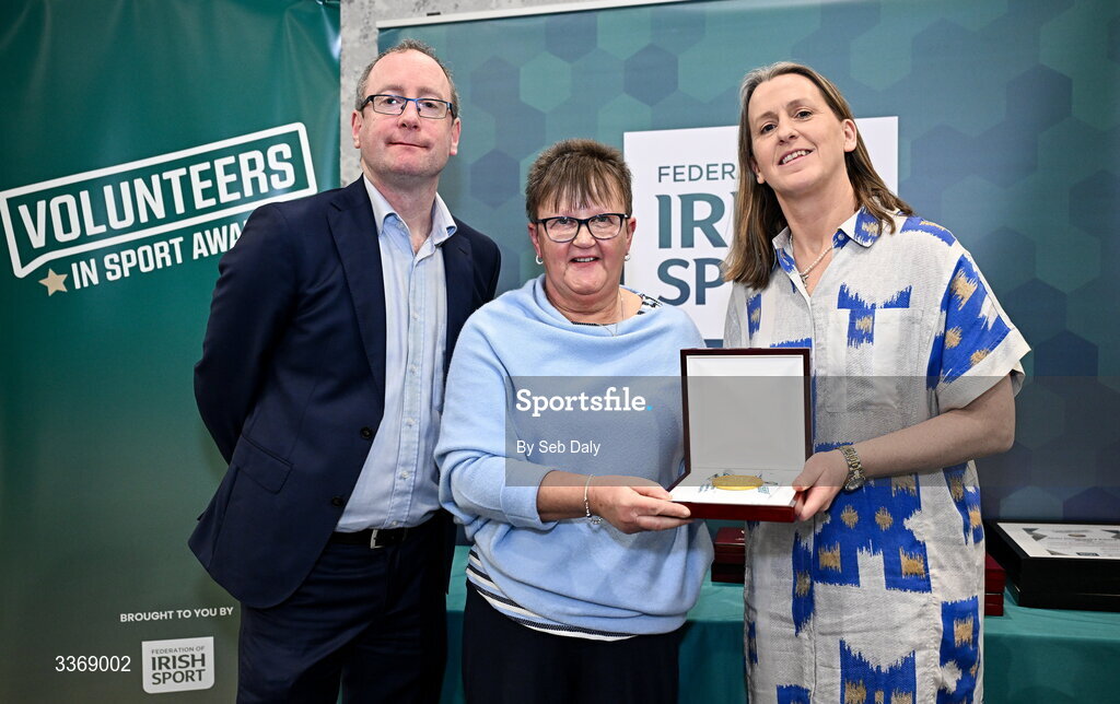 26 February 2026; Daphne Greene of Brookeborough Heber MacMahons, Fermanagh, is presented with her award by Federation of Irish Sport chief executive officer Mary O'Connor, and Dun Laoghaire Rathdown Sports Partnership coordinator Shane McArdle, during the Volunteers in Sport Awards 2025, hosted by the Federation of Irish Sport and supported by the National Network of 29 Local Sports Partnerships, at The Crowne Plaza Hotel in Blanchardstown, Dublin. Photo by Seb Daly/Sportsfile
