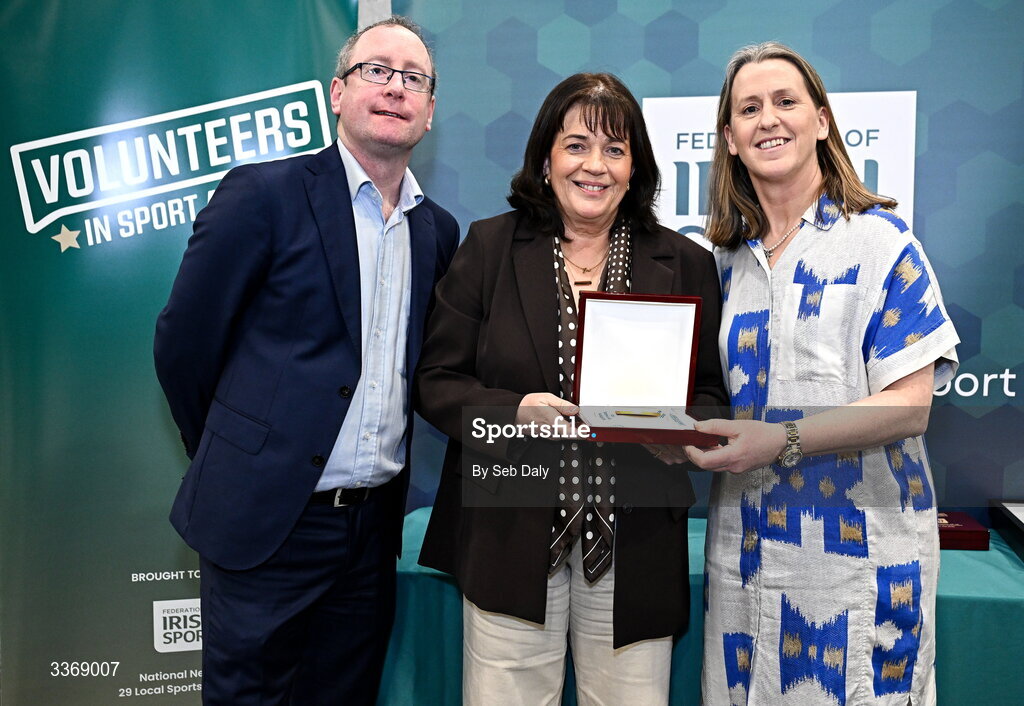 26 February 2026; Jes Gough of Kilmurry Youths FC, Mayo, is presented with her award by Federation of Irish Sport chief executive officer Mary O'Connor, and Dun Laoghaire Rathdown Sports Partnership coordinator Shane McArdle, during the Volunteers in Sport Awards 2025, hosted by the Federation of Irish Sport and supported by the National Network of 29 Local Sports Partnerships, at The Crowne Plaza Hotel in Blanchardstown, Dublin. Photo by Seb Daly/Sportsfile