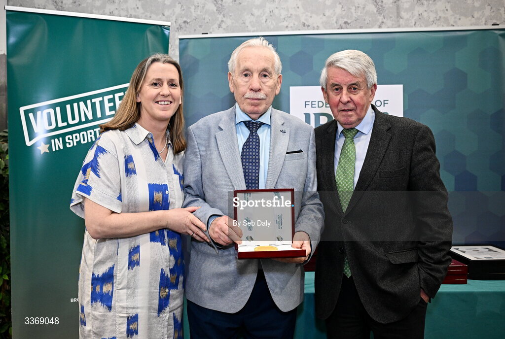 26 February 2026; Lifetime Achievement Award recipient Tony Davitt of Phoenix of Ballyboughal Boxing Club, Dublin, receives his award from Federation of Irish Sport chief executive officer Mary O'Connor, and Federation of Irish Sport chair of judging panel Roddy Guiney during the Volunteers in Sport Awards 2025, hosted by the Federation of Irish Sport and supported by the National Network of 29 Local Sports Partnerships, at The Crowne Plaza Hotel in Blanchardstown, Dublin. Photo by Seb Daly/Sportsfile