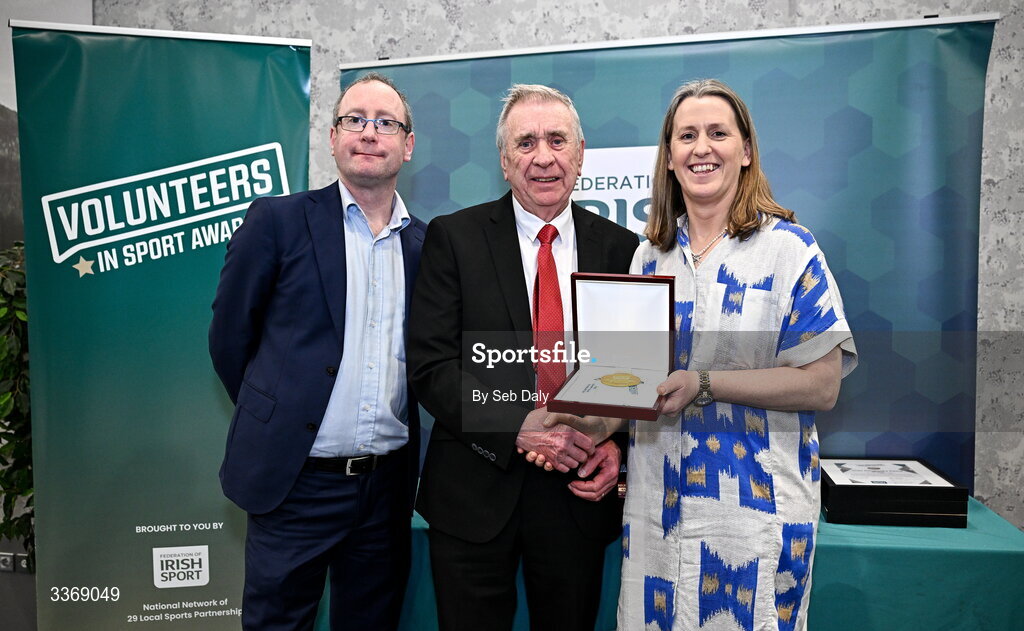 26 February 2026; Philip Johnston of Derry City FC, Derry, is presented with his award by Federation of Irish Sport chief executive officer Mary O'Connor, and Dun Laoghaire Rathdown Sports Partnership coordinator Shane McArdle, during the Volunteers in Sport Awards 2025, hosted by the Federation of Irish Sport and supported by the National Network of 29 Local Sports Partnerships, at The Crowne Plaza Hotel in Blanchardstown, Dublin. Photo by Seb Daly/Sportsfile