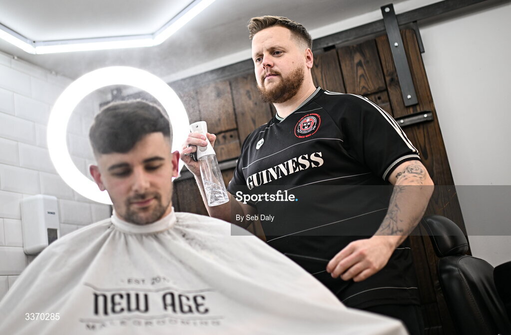 27 February 2026; Bohemians supporter, and owner of New Age Barbers in Phibsborough, Jason Blake gives a haircut to fellow Bohemians supporter Morgan Hughes before the SSE Airtricity Men's Premier Division match between Bohemians and Shamrock Rovers at Dalymount Park in Dublin. Photo by Seb Daly/Sportsfile