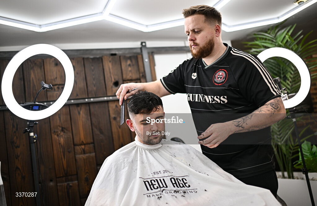 27 February 2026; Bohemians supporter, and owner of New Age Barbers in Phibsborough, Jason Blake gives a haircut to fellow Bohemians supporter Morgan Hughes before the SSE Airtricity Men's Premier Division match between Bohemians and Shamrock Rovers at Dalymount Park in Dublin. Photo by Seb Daly/Sportsfile
