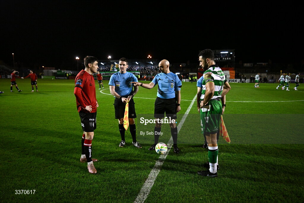 27 February 2026; Referee Neil Doyle with team captains Dawson Devoy of Bohemians and Roberto Lopes of Shamrock Rovers during the SSE Airtricity Men's Premier Division match between Bohemians and Shamrock Rovers at Dalymount Park in Dublin. Photo by Seb Daly/Sportsfile