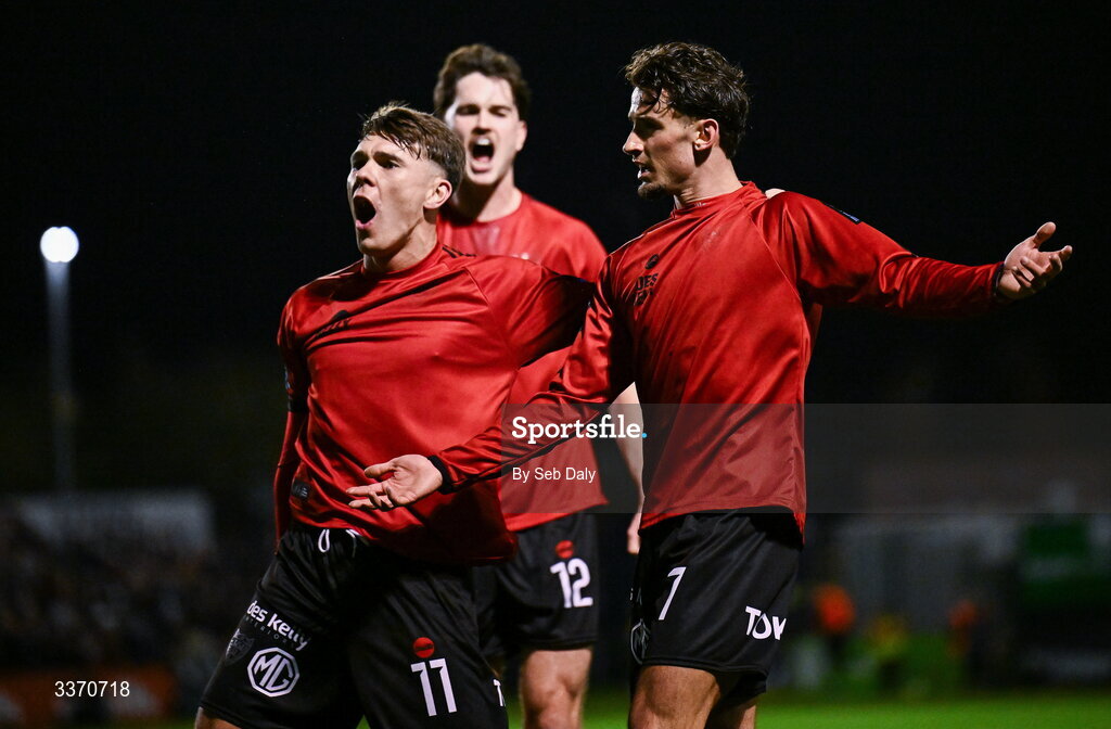 27 February 2026; Connor Parsons of Bohemians, right, celebrates with teammates Dayle Rooney, left, and Patrick Hickey after scoring their side's first try during the SSE Airtricity Men's Premier Division match between Bohemians and Shamrock Rovers at Dalymount Park in Dublin. Photo by Seb Daly/Sportsfile