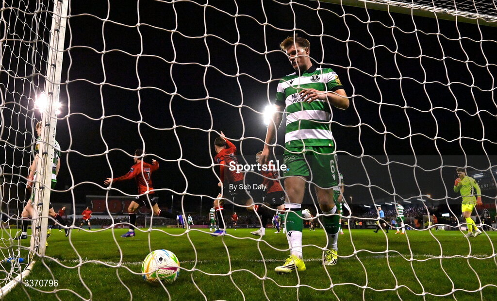 27 February 2026; Connor Parsons of Bohemians, left, celebrates after scoring his side's first goal as Daniel Cleary of Shamrock Rovers retrieves the ball from the net during the SSE Airtricity Men's Premier Division match between Bohemians and Shamrock Rovers at Dalymount Park in Dublin. Photo by Seb Daly/Sportsfile
