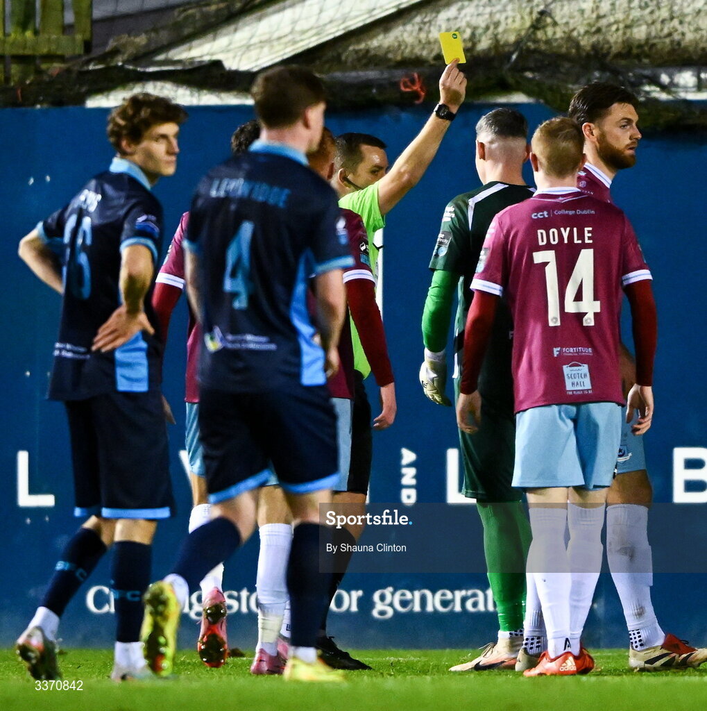 27 February 2026; Referee Robert Harvey shows Luke Dennison a yellow card during the SSE Airtricity Men's Premier Division match between Drogheda United and Shelbourne at Sullivan & Lambe Park in Drogheda, Louth. Photo by Shauna Clinton/Sportsfile