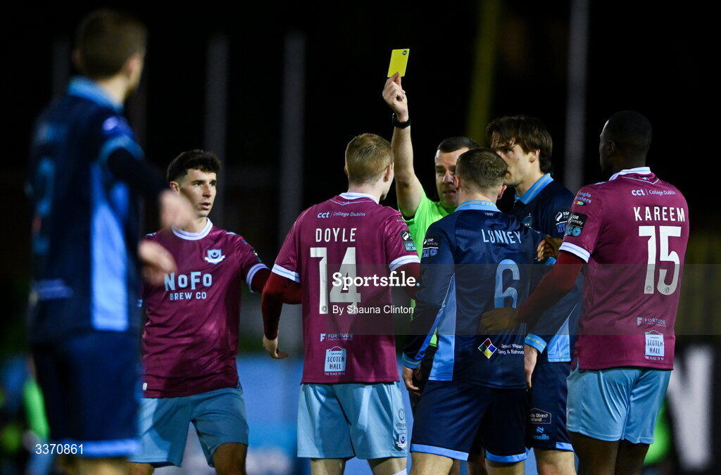27 February 2026; Referee Robert Harvey shows Mark Doyle of Drogheda United a yellow card during the SSE Airtricity Men's Premier Division match between Drogheda United and Shelbourne at Sullivan & Lambe Park in Drogheda, Louth. Photo by Shauna Clinton/Sportsfile
