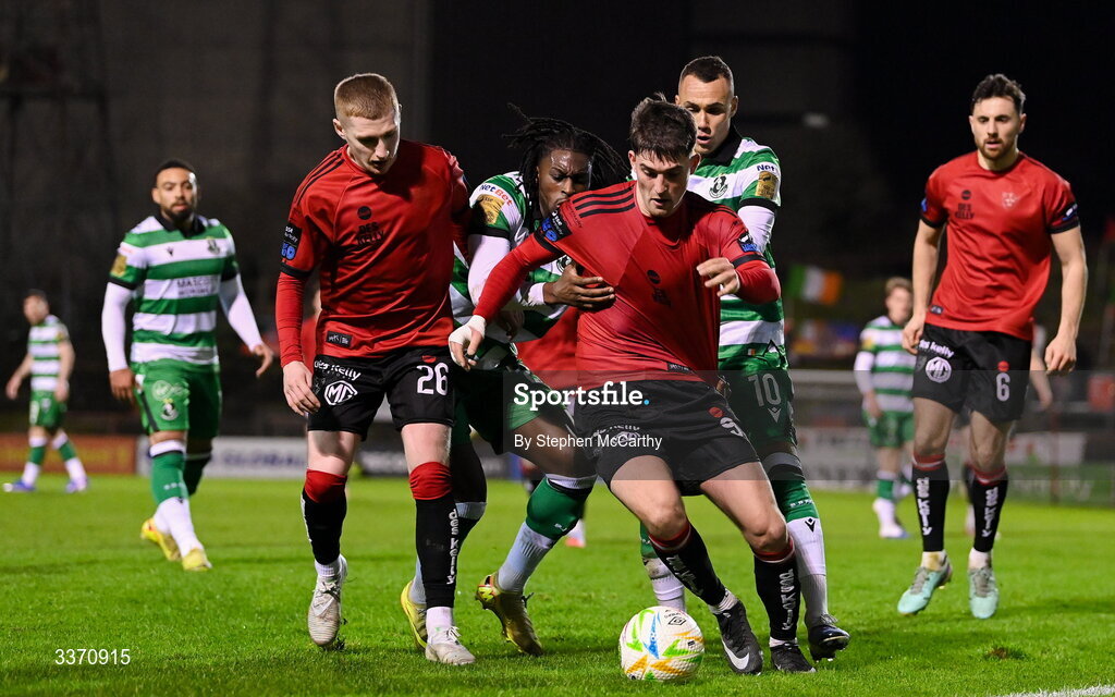 27 February 2026; Colm Whelan of Bohemians in action against Graham Burke, right, and Tunmise Sobowale of Shamrock Rovers during the SSE Airtricity Men's Premier Division match between Bohemians and Shamrock Rovers at Dalymount Park in Dublin. Photo by Stephen McCarthy/Sportsfile