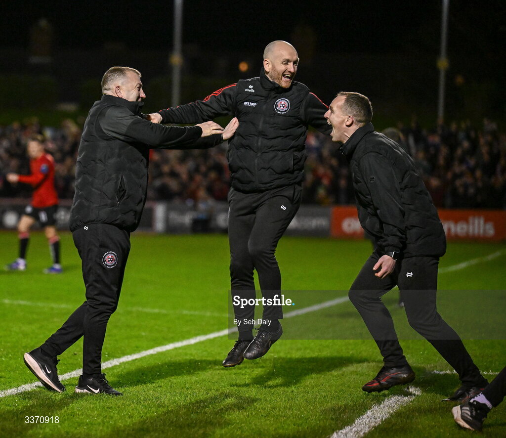27 February 2026; Bohemians manager Alan Reynolds, left, Bohemians assistant manager Stephen O'Donnell, centre, and Bohemians first team coach Derek Pender celebrate as Ross Tierney scores their side's third goal during the SSE Airtricity Men's Premier Division match between Bohemians and Shamrock Rovers at Dalymount Park in Dublin. Photo by Seb Daly/Sportsfile