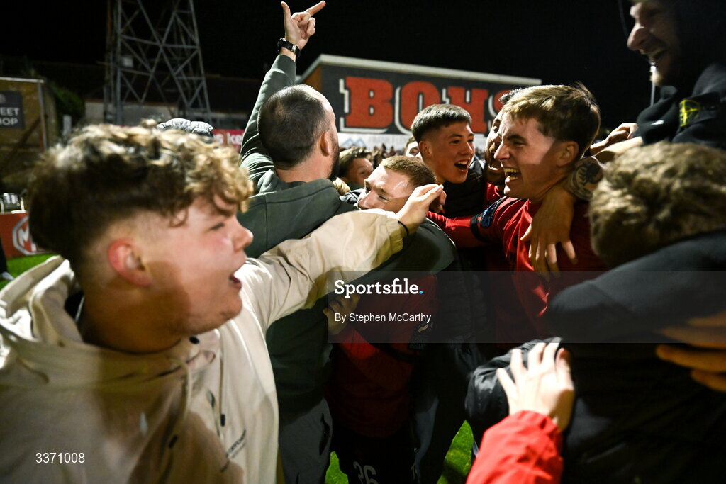 27 February 2026; Ross Tierney of Bohemians, centre, celebrates with supporters after scoring their side's third goal during the SSE Airtricity Men's Premier Division match between Bohemians and Shamrock Rovers at Dalymount Park in Dublin. Photo by Stephen McCarthy/Sportsfile
