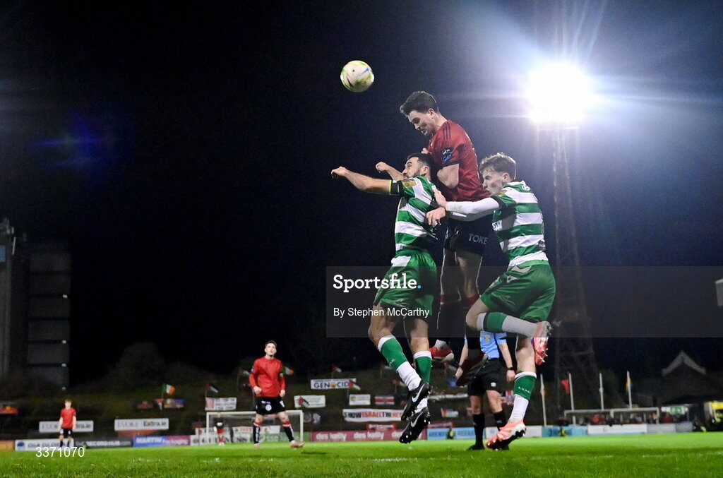27 February 2026; Patrick Hickey of Bohemians in action against Matt Healy, left, and Roberto Lopes of Shamrock Rovers during the SSE Airtricity Men's Premier Division match between Bohemians and Shamrock Rovers at Dalymount Park in Dublin. Photo by Stephen McCarthy/Sportsfile