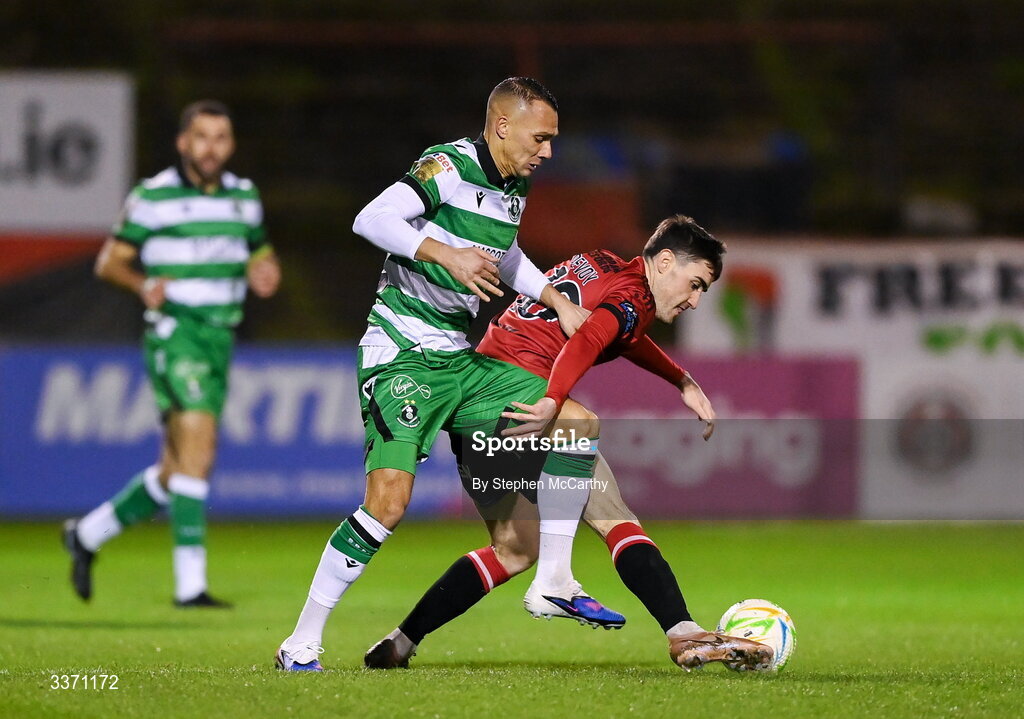 27 February 2026; Dawson Devoy of Bohemians is tackled by Graham Burke of Shamrock Rovers during the SSE Airtricity Men's Premier Division match between Bohemians and Shamrock Rovers at Dalymount Park in Dublin.  Photo by Stephen McCarthy/Sportsfile