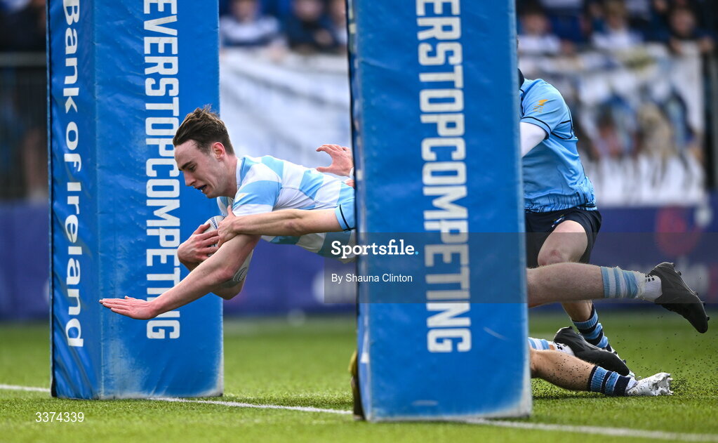 2 March 2026; Bernard White of Blackrock College scores his side's first try despite the efforts of Harrison McMahon of St Michael's College during the Bank of Ireland Leinster Rugby Boys Schools Senior Cup semi-final match between St Michael's College and Blackrock College at Energia Park in Dublin. Photo by Shauna Clinton/Sportsfile