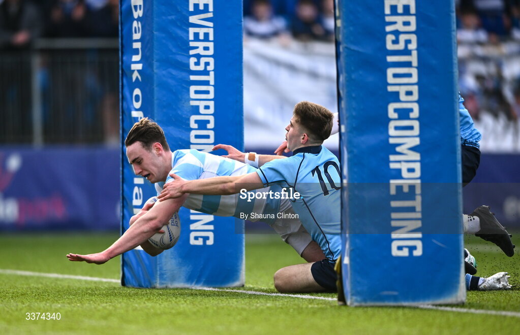 2 March 2026; Bernard White of Blackrock College scores his side's first try despite the efforts of Harrison McMahon of St Michael's College during the Bank of Ireland Leinster Rugby Boys Schools Senior Cup semi-final match between St Michael's College and Blackrock College at Energia Park in Dublin. Photo by Shauna Clinton/Sportsfile