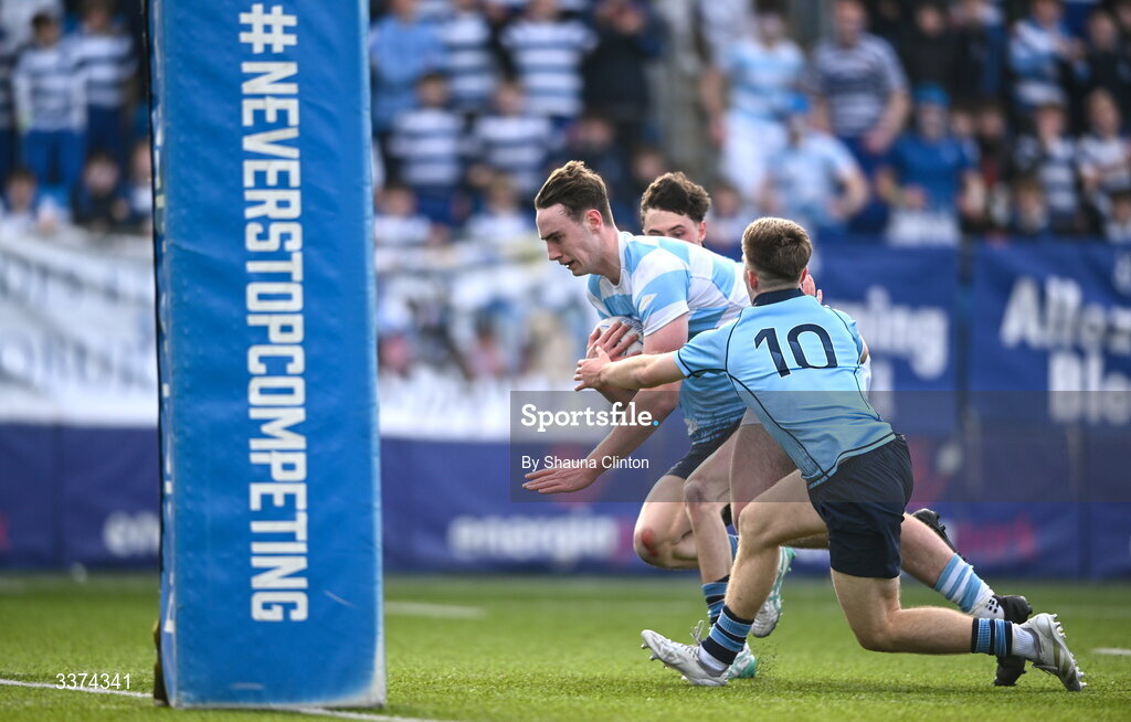 2 March 2026; Bernard White of Blackrock College scores his side's first try despite the efforts of Harrison McMahon of St Michael's College during the Bank of Ireland Leinster Rugby Boys Schools Senior Cup semi-final match between St Michael's College and Blackrock College at Energia Park in Dublin. Photo by Shauna Clinton/Sportsfile