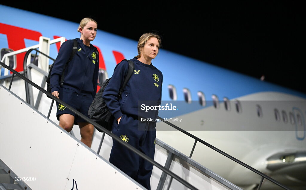 5 March 2026; Republic of Ireland's Kyra Carusa, right, and Jessie Stapleton at Amsterdam's Schiphol Airport following Republic of Ireland women's travel to the Netherlands for their 2027 FIFA Women’s World Cup Qualifier against the Netherlands in Utrecht on Saturday. Photo by Stephen McCarthy/Sportsfile
