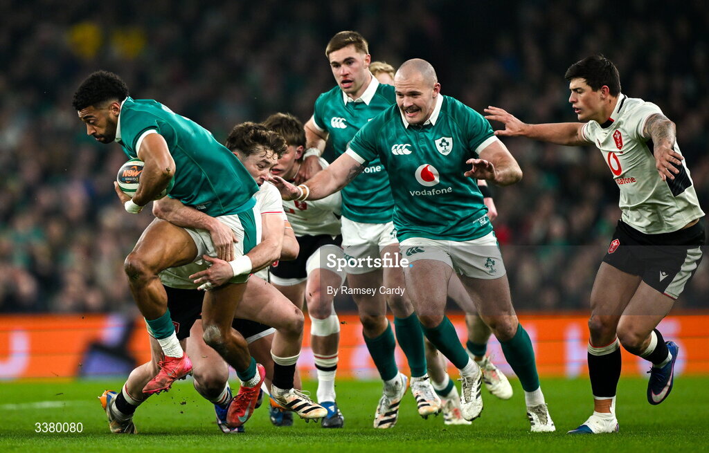 6 March 2026; Robert Baloucoune of Ireland is tackled by Dan Edwards of Wales during the Guinness 6 Nations Rugby Championship match between Ireland and Wales at the Aviva Stadium in Dublin. Photo by Ramsey Cardy/Sportsfile