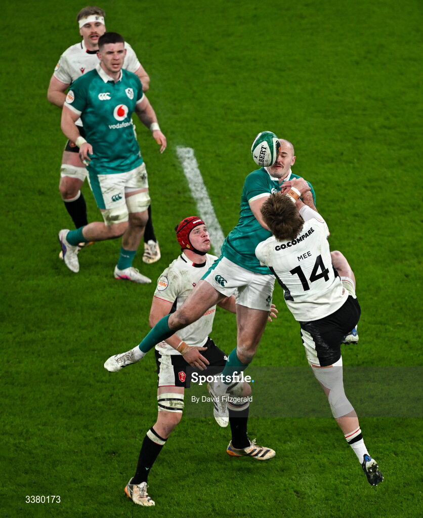 6 March 2026; Jacob Stockdale of Ireland and Ellis Mee of Wales contest a high ball during the Guinness 6 Nations Rugby Championship match between Ireland and Wales at the Aviva Stadium in Dublin. Photo by David Fitzgerald/Sportsfile
