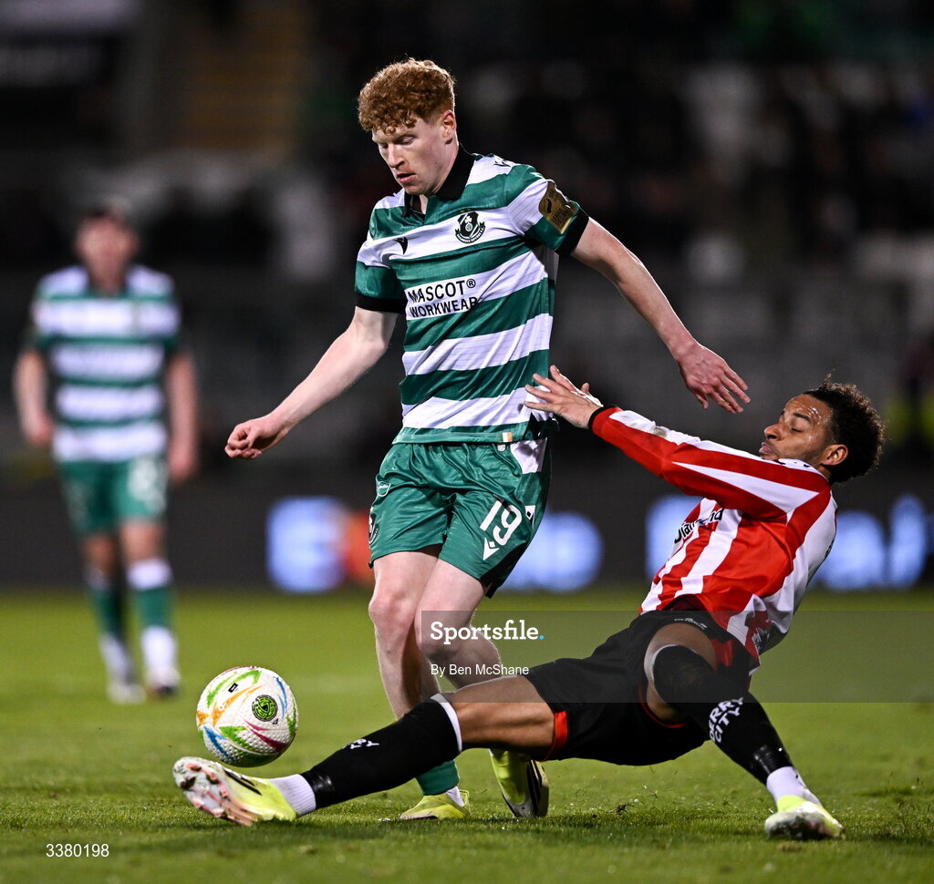 6 March 2026; Adam Brennan of Shamrock Rovers is tackled by Barry Cotter of Derry City during the SSE Airtricity Men's Premier Division match between Shamrock Rovers and Derry City at Tallaght Stadium in Dublin. Photo by Ben McShane/Sportsfile