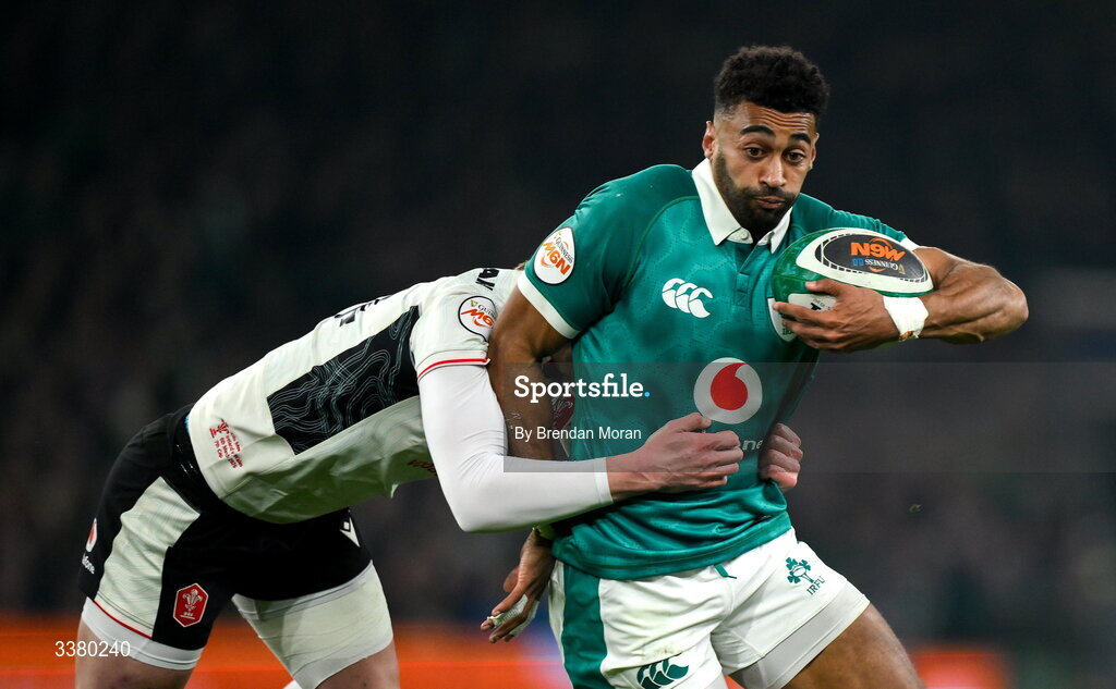 6 March 2026; Robert Baloucoune of Ireland is tackled by Ellis Mee of Wales during the Guinness 6 Nations Rugby Championship match between Ireland and Wales at the Aviva Stadium in Dublin. Photo by Brendan Moran/Sportsfile