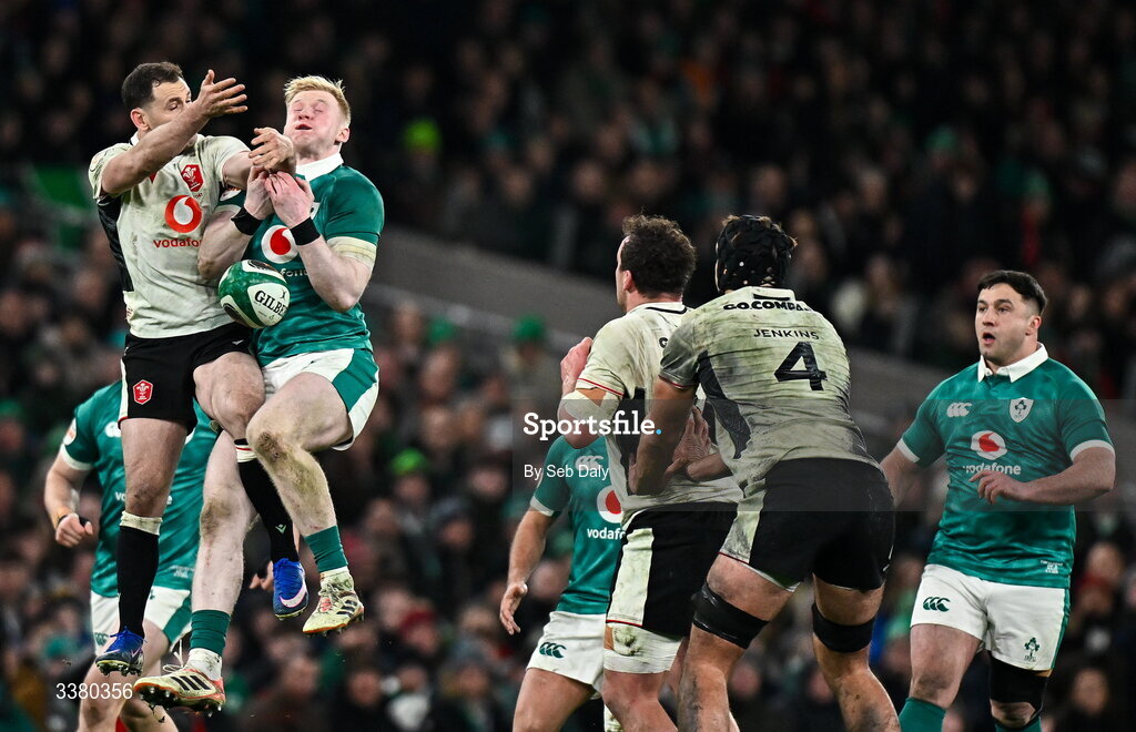 6 March 2026; Jamie Osborne of Ireland and Tomos Williams of Wales contest a high ball during the Guinness 6 Nations Rugby Championship match between Ireland and Wales at the Aviva Stadium in Dublin. Photo by Seb Daly/Sportsfile