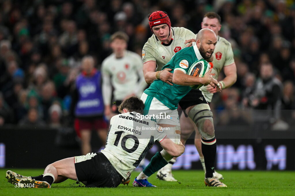 6 March 2026; Jamison Gibson-Park of Ireland is tackled by Wales players Dan Edwards, left, and James Botham during the Guinness 6 Nations Rugby Championship match between Ireland and Wales at the Aviva Stadium in Dublin. Photo by Brendan Moran/Sportsfile