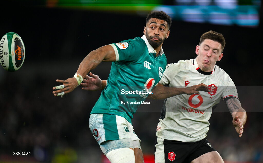 6 March 2026; Robert Baloucoune of Ireland offloads despite the tackle of Josh Adams of Wales during the Guinness 6 Nations Rugby Championship match between Ireland and Wales at the Aviva Stadium in Dublin. Photo by Brendan Moran/Sportsfile
