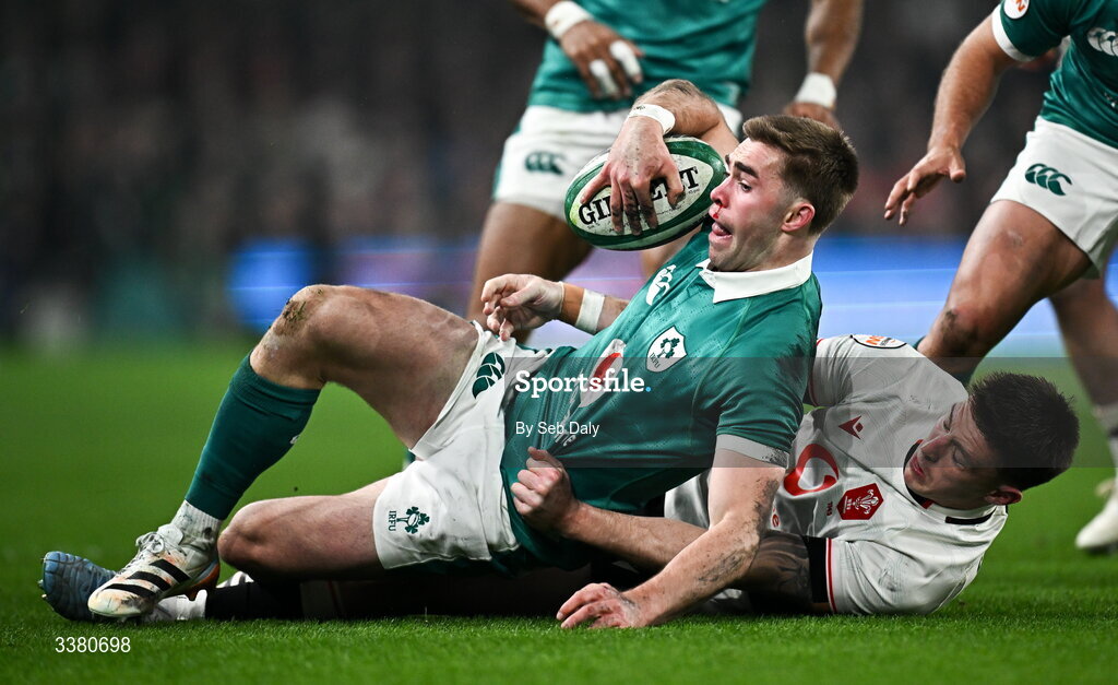 6 March 2026; Jack Crowley of Ireland is tackled by Josh Adams of Wales during the Guinness 6 Nations Rugby Championship match between Ireland and Wales at the Aviva Stadium in Dublin. Photo by Seb Daly/Sportsfile