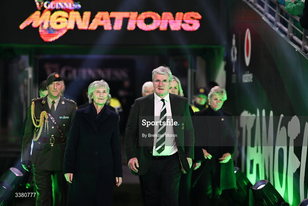 6 March 2026; President of Ireland Catherine Connolly, left, and IRFU president John O'Driscoll make their way to meet the teams before the Guinness 6 Nations Rugby Championship match between Ireland and Wales at the Aviva Stadium in Dublin. Photo by Brendan Moran/Sportsfile