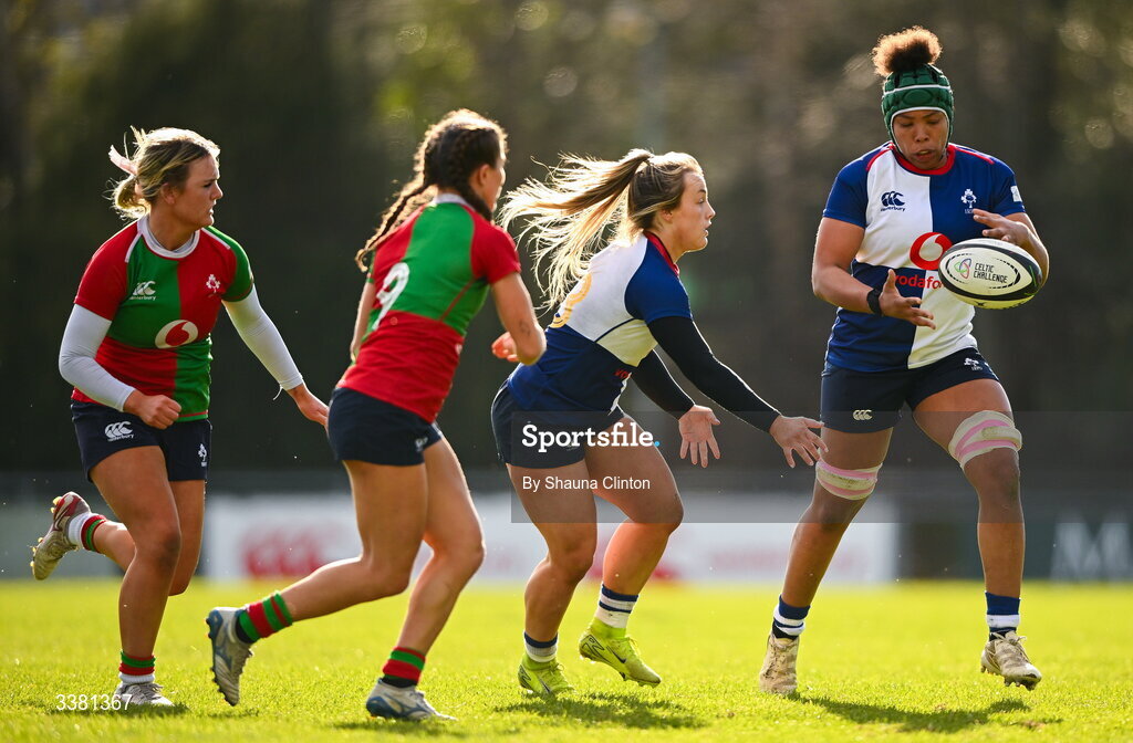 7 March 2026; Aoife Dalton of Wolfhounds makes a pass to team-mate Grace Moore during the Celtic Challenge Round 10 match between Wolfhounds and Clovers at Belfield Bowl in Dublin. Photo by Shauna Clinton/Sportsfile