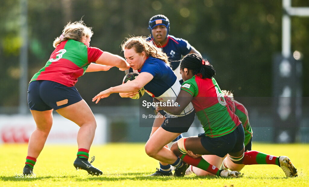 7 March 2026; Niamh Marley of Wolfhounds is tackled by Sadhbh McGrath, left, and Faith Oviawe during the Celtic Challenge Round 10 match between Wolfhounds and Clovers at Belfield Bowl in Dublin. Photo by Shauna Clinton/Sportsfile