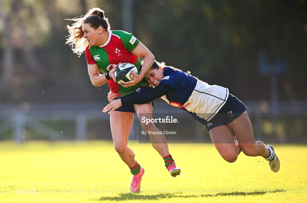 7 March 2026; Béibhinn Parsons of Clovers is tackled by Vicky Elmes Kinlan of Wolfhounds during the Celtic Challenge Round 10 match between Wolfhounds and Clovers at Belfield Bowl in Dublin. Photo by Shauna Clinton/Sportsfile