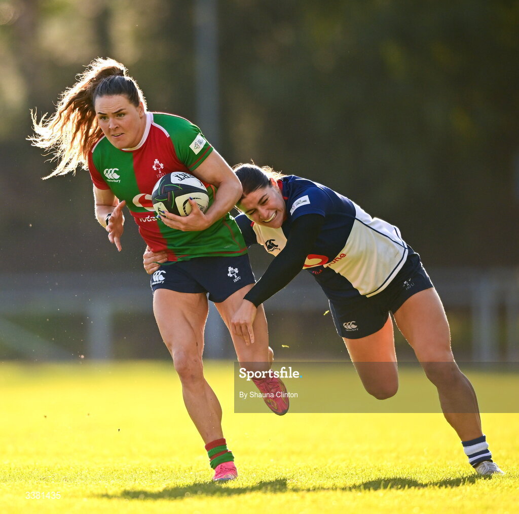 7 March 2026; Béibhinn Parsons of Clovers is tackled by Vicky Elmes Kinlan of Wolfhounds during the Celtic Challenge Round 10 match between Wolfhounds and Clovers at Belfield Bowl in Dublin. Photo by Shauna Clinton/Sportsfile