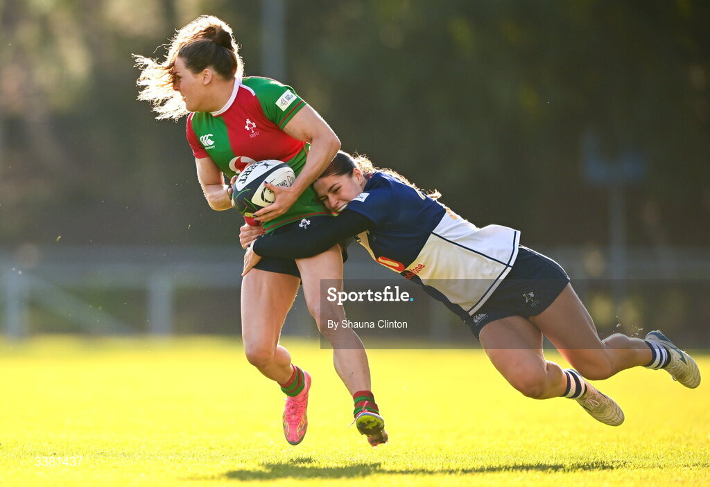 7 March 2026; Béibhinn Parsons of Clovers is tackled by Vicky Elmes Kinlan of Wolfhounds during the Celtic Challenge Round 10 match between Wolfhounds and Clovers at Belfield Bowl in Dublin. Photo by Shauna Clinton/Sportsfile