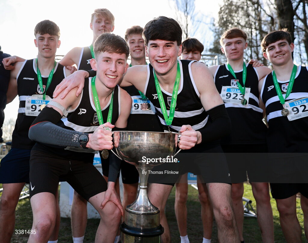 7 March 2026; Athletes of Belvedere College, Dublin, celebrate after the 123.ie All Ireland Schools’ Cross Country Championships at Mallusk Playing Fields in Newtownabbey, Antrim. Photo by Thomas Flinkow/Sportsfile
