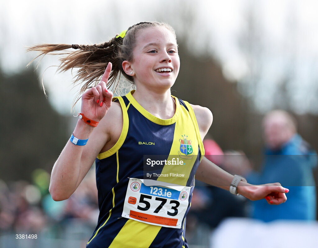 7 March 2026; Freya Renton of Sacred Heart School Westport, Mayo, celebrates at the finish line after winning the inter girls event during the 123.ie All Ireland Schools’ Cross Country Championships at Mallusk Playing Fields in Newtownabbey, Antrim. Photo by Thomas Flinkow/Sportsfile