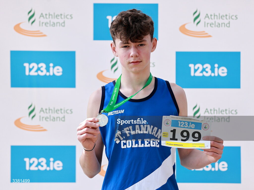 7 March 2026; Stephen Geraghty of St Flannans Ennis, Clare, celebrates with his gold medal after winning the minor boys event during the 123.ie All Ireland Schools’ Cross Country Championships at Mallusk Playing Fields in Newtownabbey, Antrim. Photo by Thomas Flinkow/Sportsfile