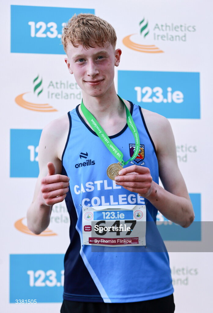 7 March 2026; Darragh Whelan of Castletroy College, Limerick, celebrates with his gold medal after winning the inter boys event during the 123.ie All Ireland Schools’ Cross Country Championships at Mallusk Playing Fields in Newtownabbey, Antrim. Photo by Thomas Flinkow/Sportsfile