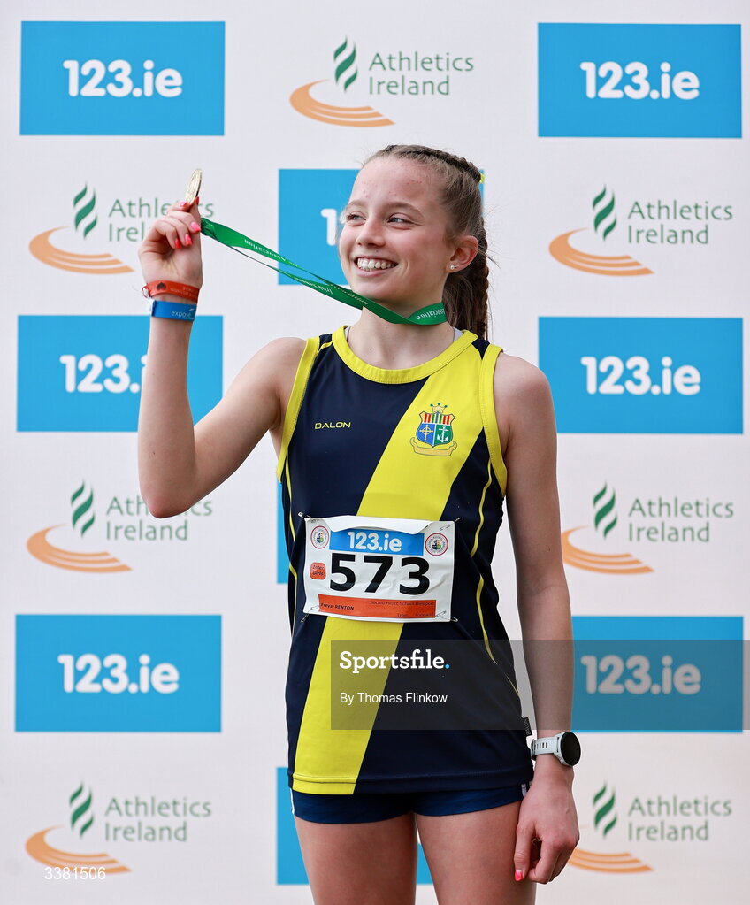 7 March 2026; Freya Renton of Sacred Heart School Westport, Mayo, celebrates with her gold medal after winning the inter girls event during the 123.ie All Ireland Schools’ Cross Country Championships at Mallusk Playing Fields in Newtownabbey, Antrim. Photo by Thomas Flinkow/Sportsfile