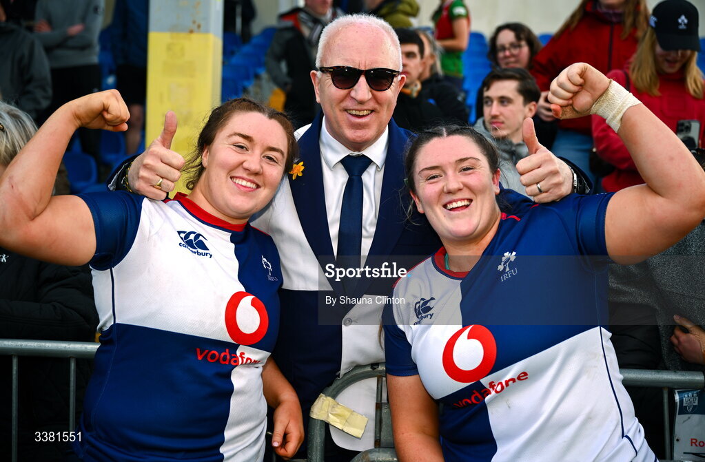 7 March 2026; Wolfhounds players and sisters, Emma-Jane, left, and Hannah Wilson with their father Dave after their side's victory in the Celtic Challenge Round 10 match between Wolfhounds and Clovers at Belfield Bowl in Dublin. Photo by Shauna Clinton/Sportsfile