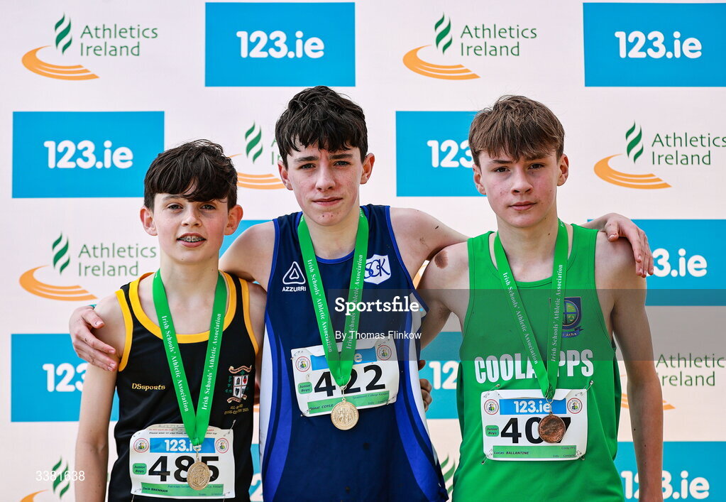 7 March 2026; Gold medalist Dónal Coyle of Seamount College Kinvara, Galway, with Jack Brennan of Patrician Secondary School Co. Kildare, left, and Lucas Ballantine of Coola PPS, Sligo, after competing in the junior boys event during the 123.ie All Ireland Schools’ Cross Country Championships at Mallusk Playing Fields in Newtownabbey, Antrim. Photo by Thomas Flinkow/Sportsfile