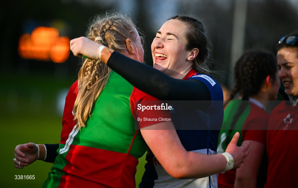 7 March 2026; Eve Higgins of Wolfhounds, right, and Ailish Quinn of Clovers hug after the Celtic Challenge Round 10 match between Wolfhounds and Clovers at Belfield Bowl in Dublin. Photo by Shauna Clinton/Sportsfile