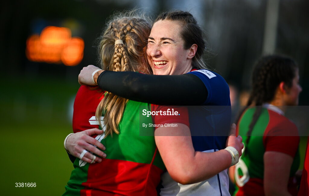 7 March 2026; Eve Higgins of Wolfhounds, right, and Ailish Quinn of Clovers hug after the Celtic Challenge Round 10 match between Wolfhounds and Clovers at Belfield Bowl in Dublin. Photo by Shauna Clinton/Sportsfile