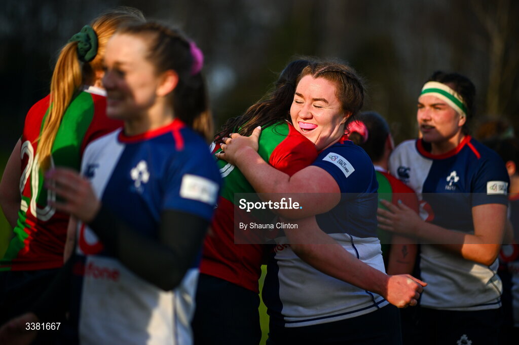 7 March 2026; Emma-Jane Wilson of Wolfhounds hugs Clovers players after the Celtic Challenge Round 10 match between Wolfhounds and Clovers at Belfield Bowl in Dublin. Photo by Shauna Clinton/Sportsfile