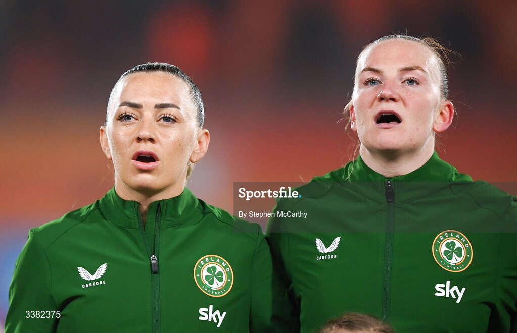 7 March 2026; Republic of Ireland captain Katie McCabe and goalkeeper Courtney Brosnan stand for the playing of the Amhrán na bhFiann before the 2027 FIFA Women’s World Cup Qualifier match between the Netherlands and Republic of Ireland at Stadion Galgenwaard in Utrecht, Netherlands. Photo by Stephen McCarthy/Sportsfile